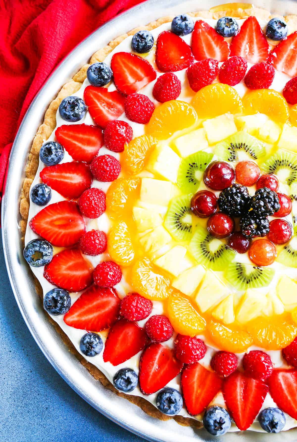 Fruit pizza on a pizza sheet. 