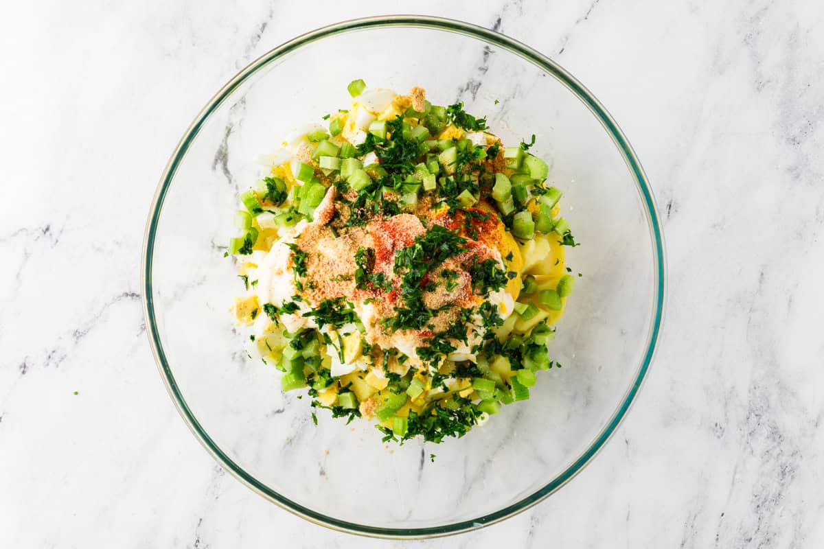 Top view of potato salad ingredients, before they're mixed.
