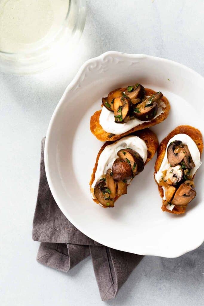 mushroom and goat cheese crostini in a bowl