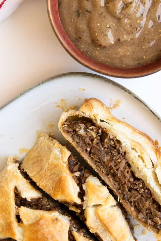 slices of lentil wellington served on a plate