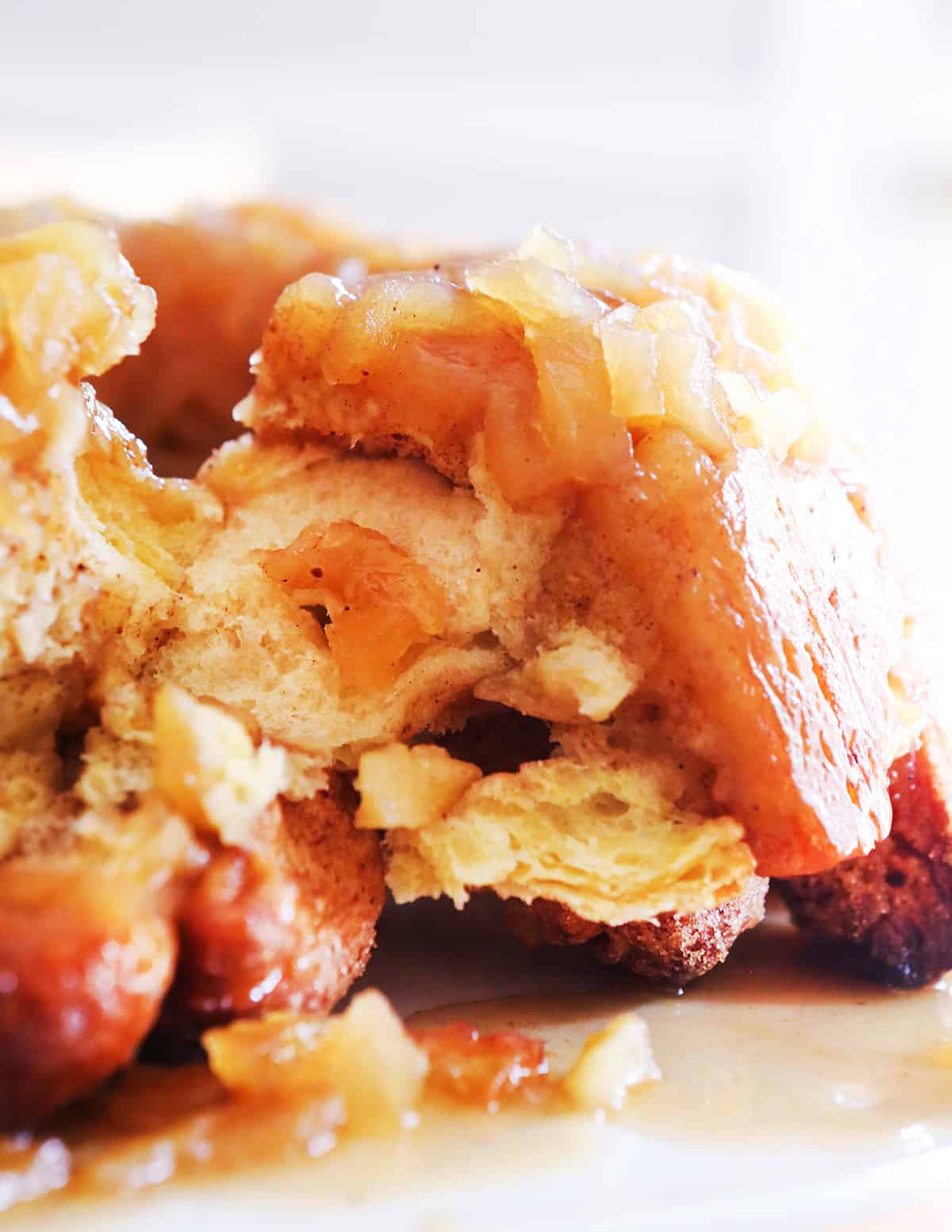 Peeking into the inside of a loaf of apple-covered monkey bread.