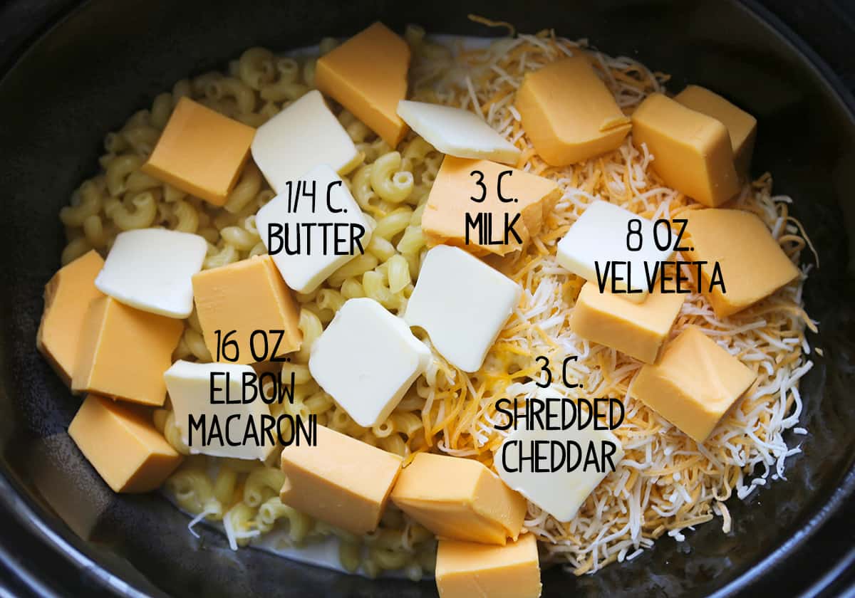 Ingredients for crockpot mac and cheese recipe inside a slow cooker.