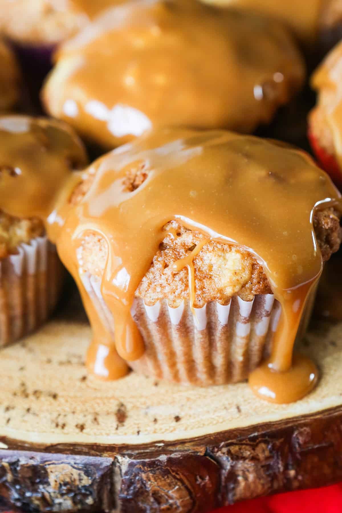 caramel dripping down sides of a cupcake.