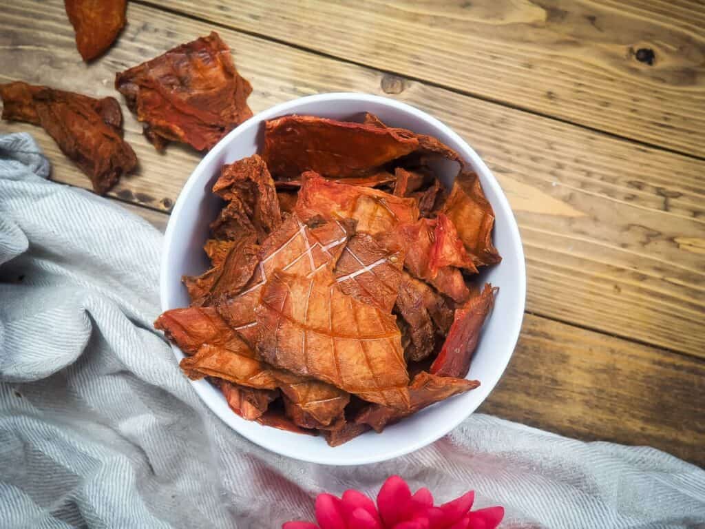 Bowl of dehydrated watermelon on a table. 