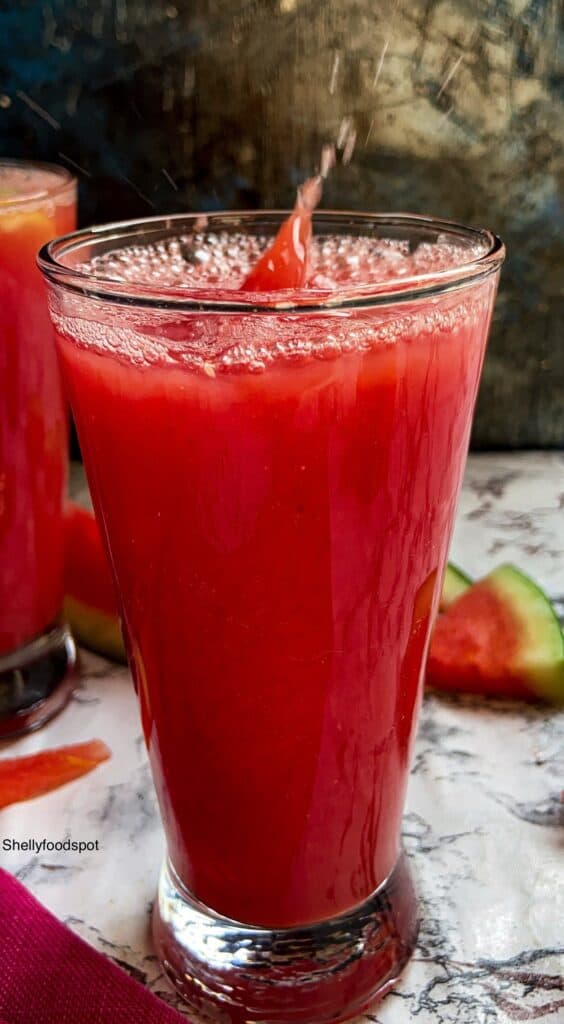 glass of red watermelon juice with a splash.