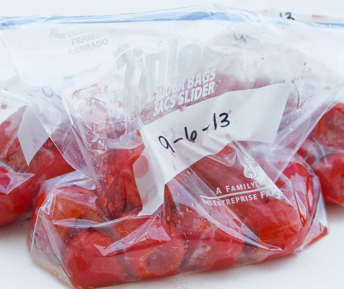 Roma tomatoes in ziploc bags ready for freezing.