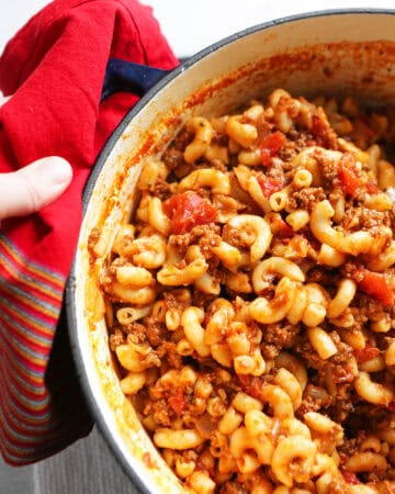 Hearty old fashioned goulash dish cooked in a Dutch oven, perfect for family dinners and comfort fo.