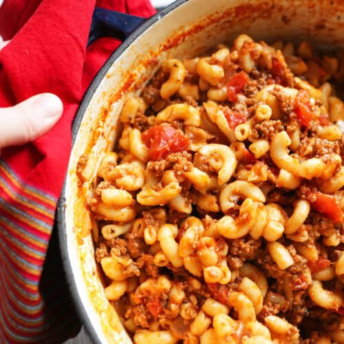 Hearty old fashioned goulash dish cooked in a Dutch oven, perfect for family dinners and comfort fo.