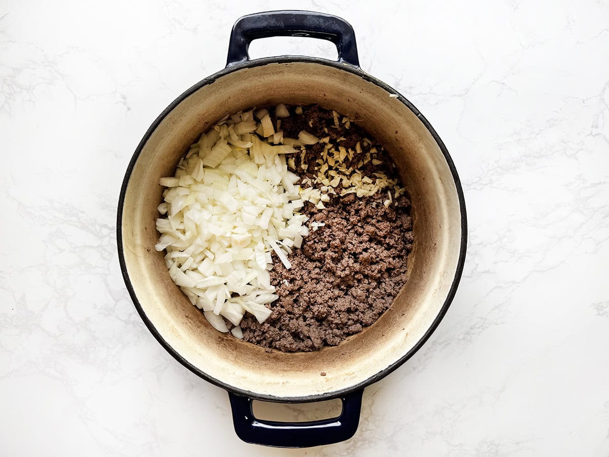 Beef and onion filling cooking in a pot, ready for a savory dish.