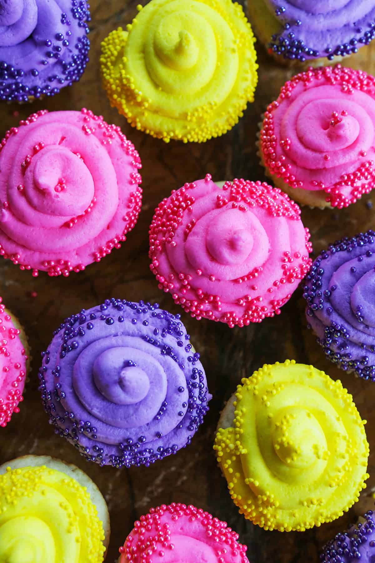 Top view of colorfully decorated cupcakes.