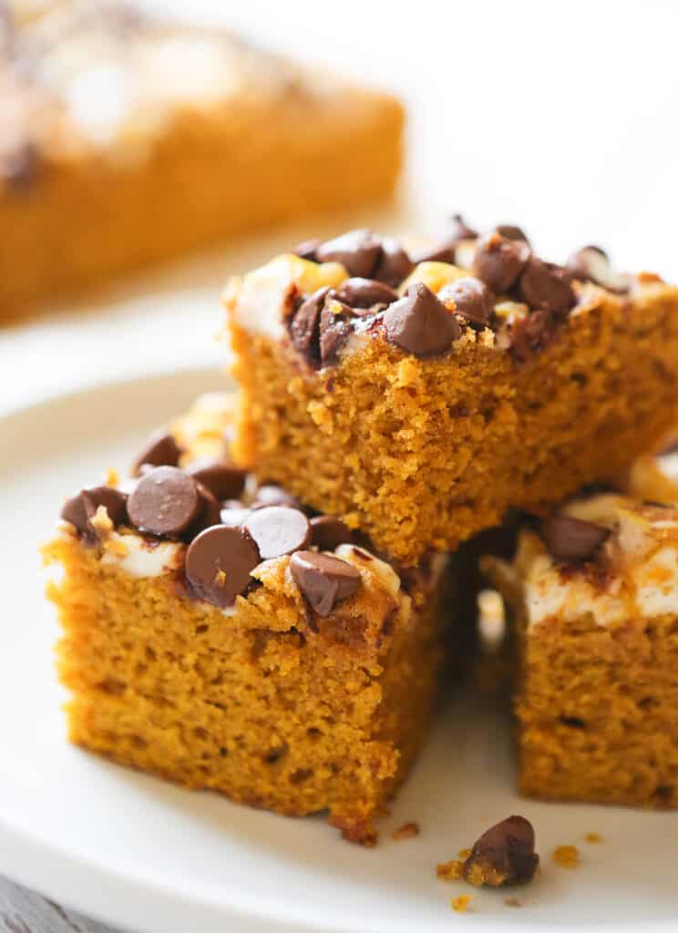 Pumpkin cake with cream cheese and chocolate chips over the top. 