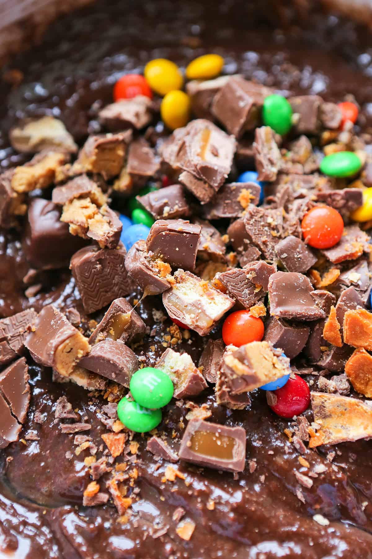 Candy bar pieces in brownie batter.