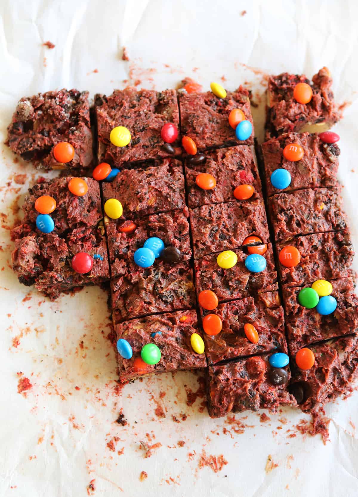 top view of sliced dessert bars with M&M’s on top.
