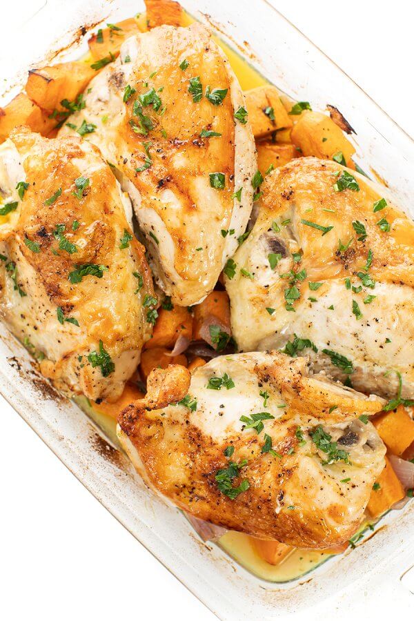 Casserole dish of chicken baked with sweet potatoes. 
