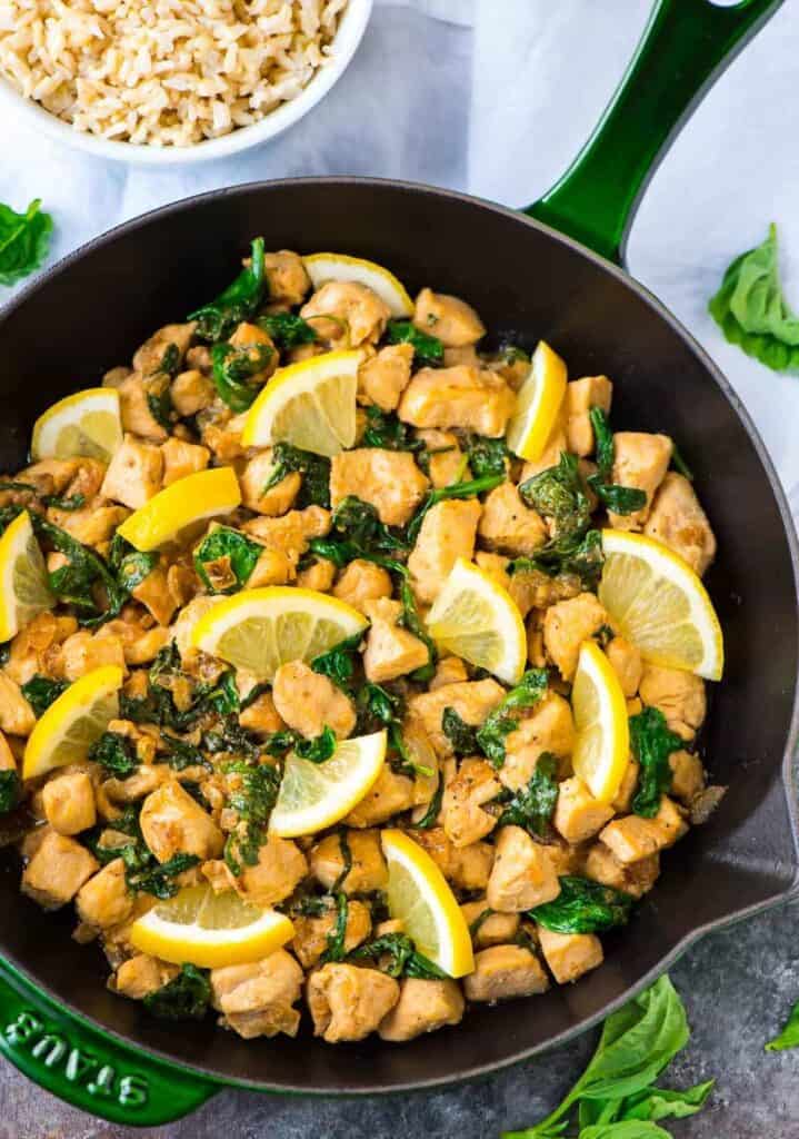 Lemon basil chicken prepared and sitting in a skillet.