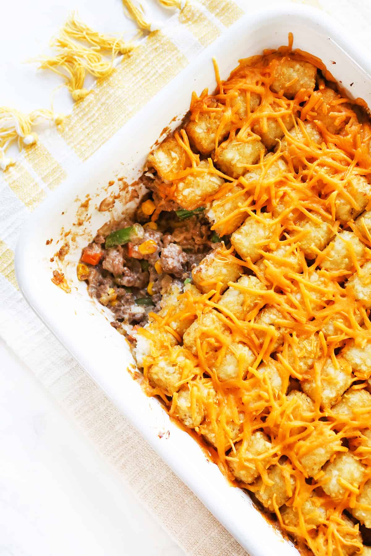 EN_US: Cheesy Chicken Enchiladas Casserole with melted cheese and flavorful ingredients.