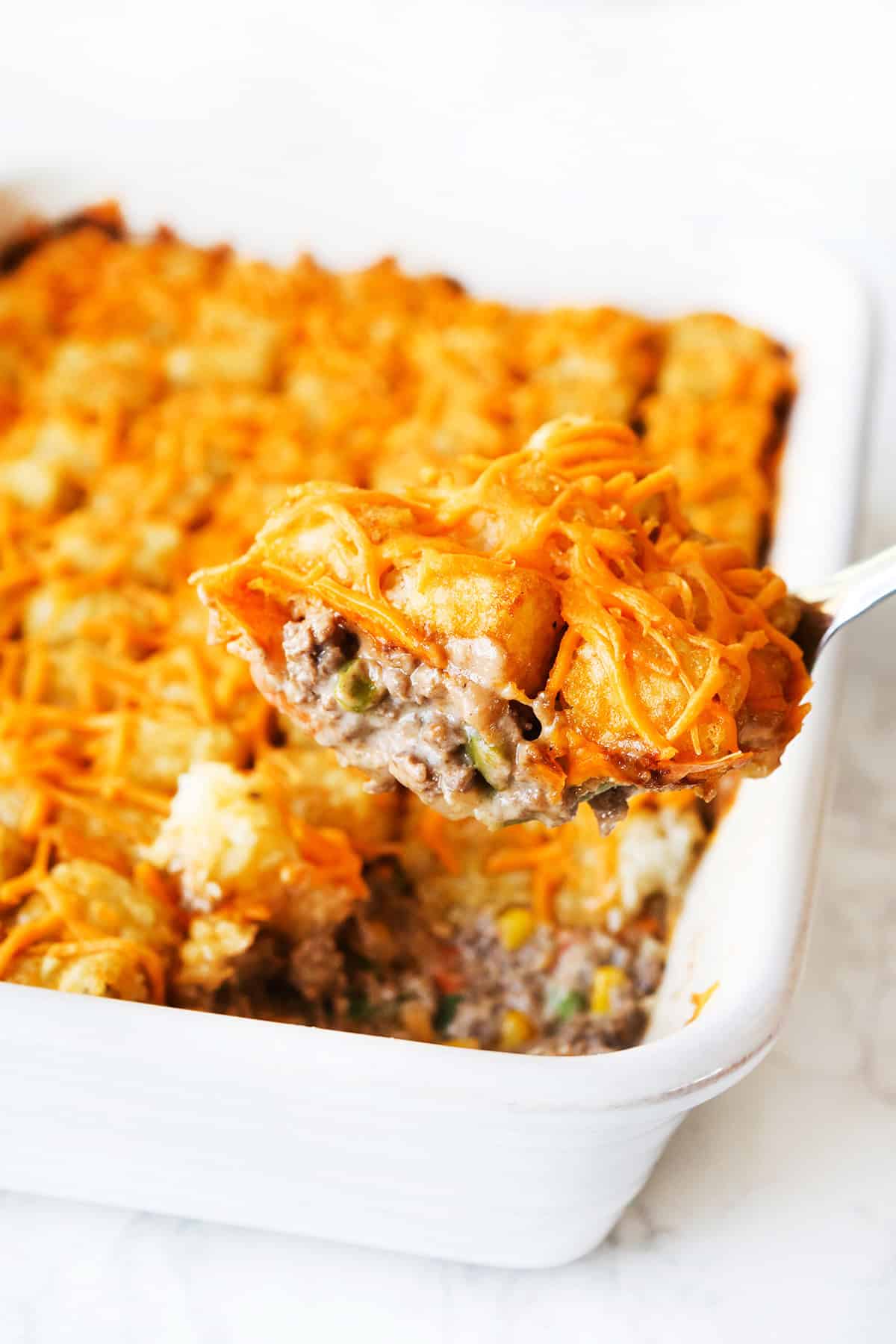 Delicious cheesy ground beef and pasta casserole with melted cheese and savory flavors.