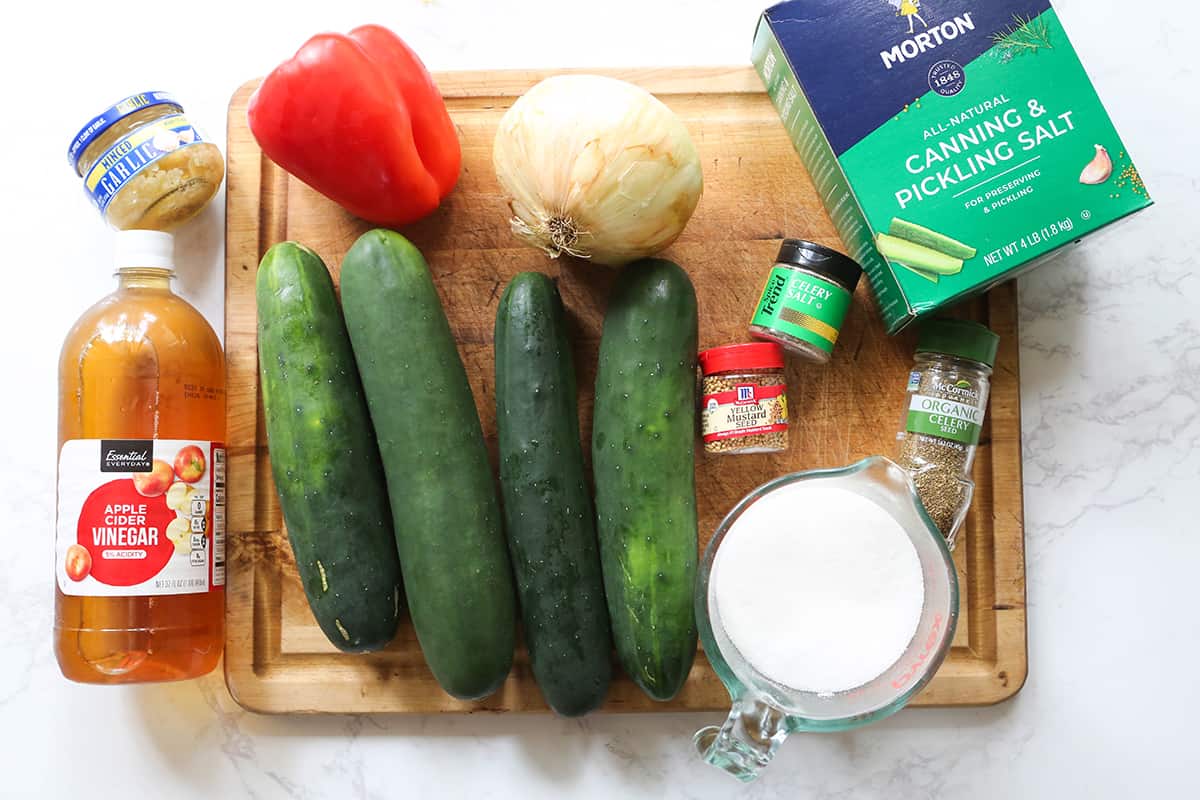 Relish ingredients sitting on a giant cutting board.