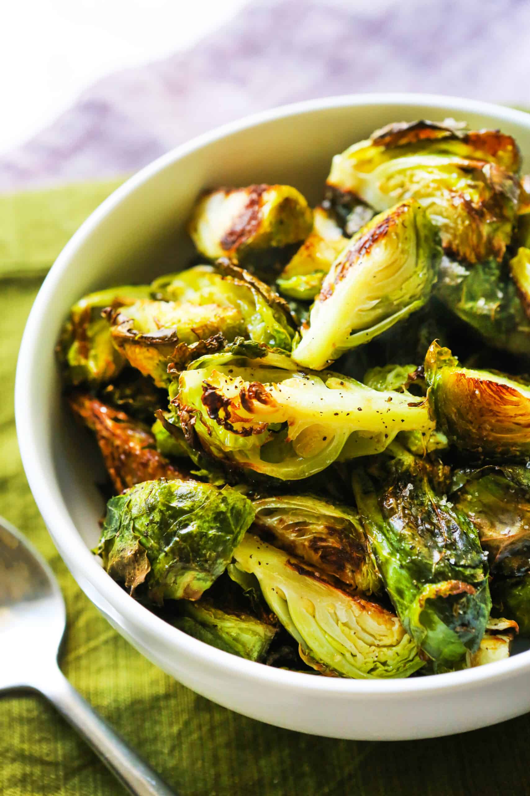 Roasted brussels sprouts in a serving bowl.