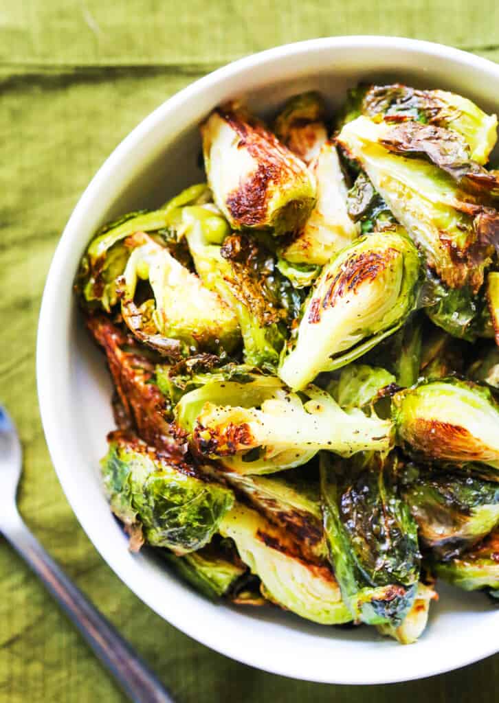 Top view of a bowl full of roasted brussels sprouts.