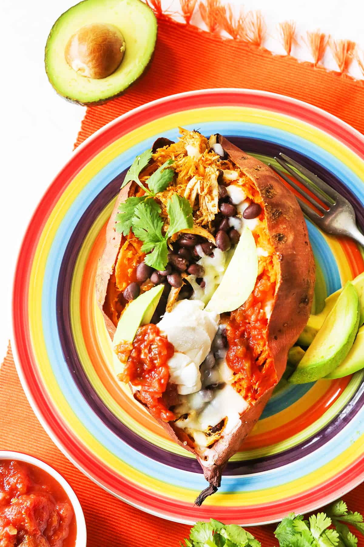 Top view of a stuffed sweet potato, loaded with mexican ingredients.