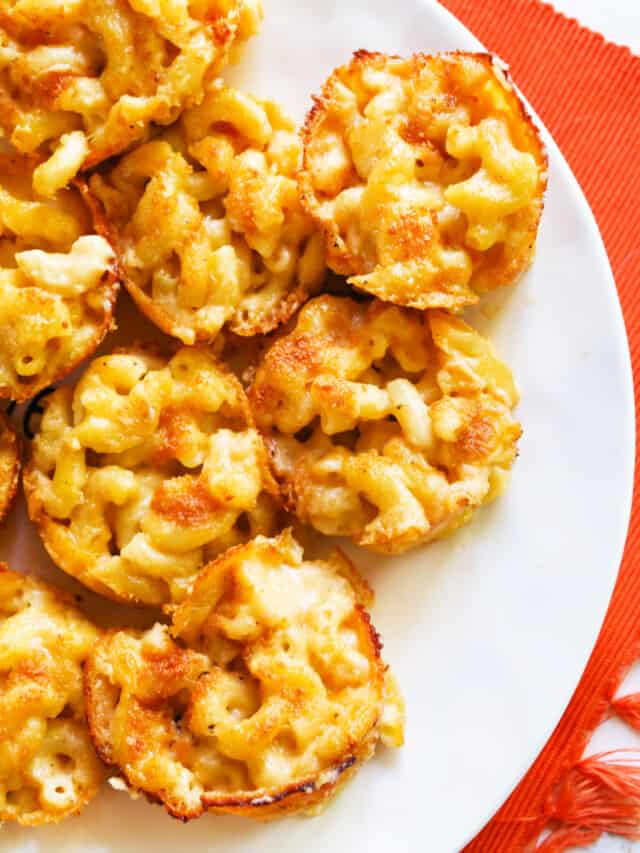 Baked mac and cheese bites on a plate. 