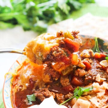 Close-up of a bowl of bean-free chili with ground beef and vegetables.