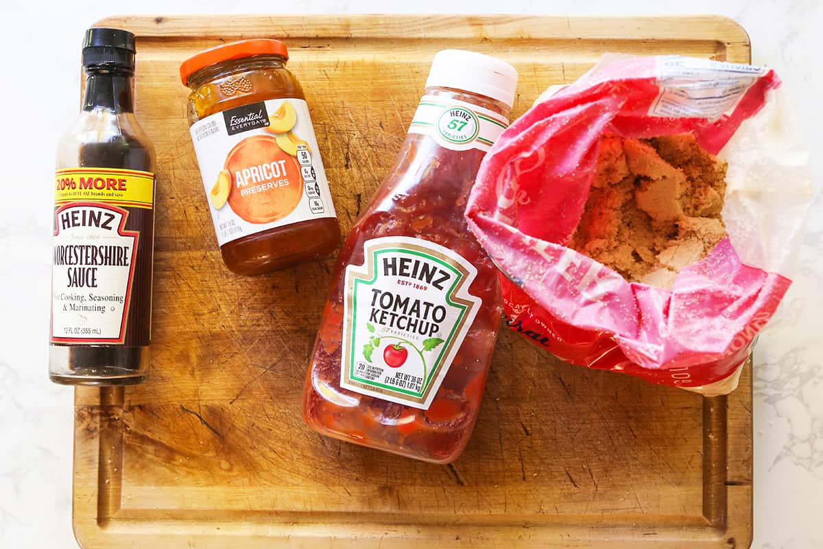 Meatloaf red sauce ingredients lined up on a cutting board.