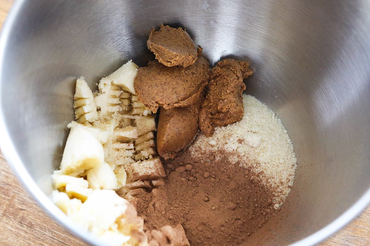 almond butter banana cookie ingredients in a mixing bowl.
