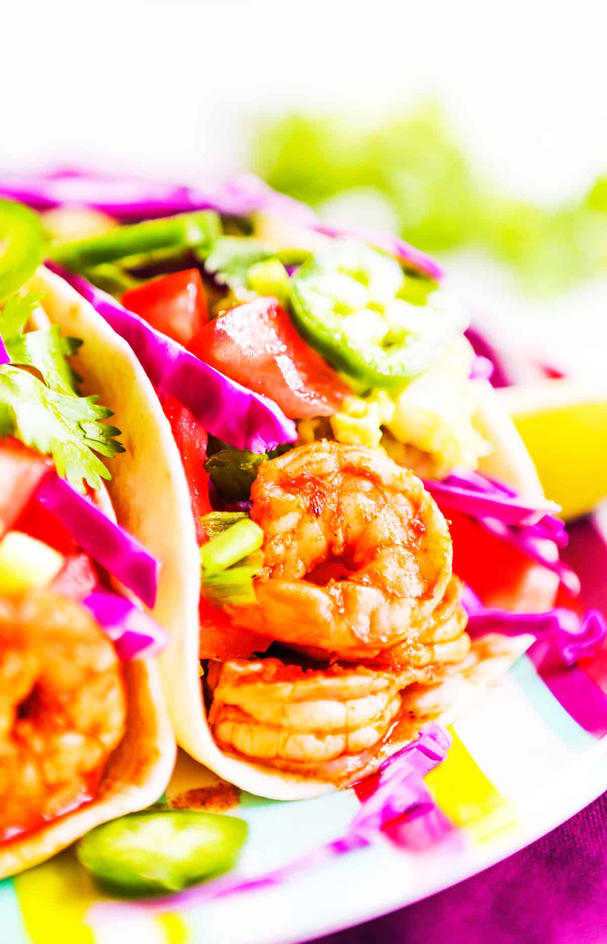 Close up of shrimp tacos on a plate.