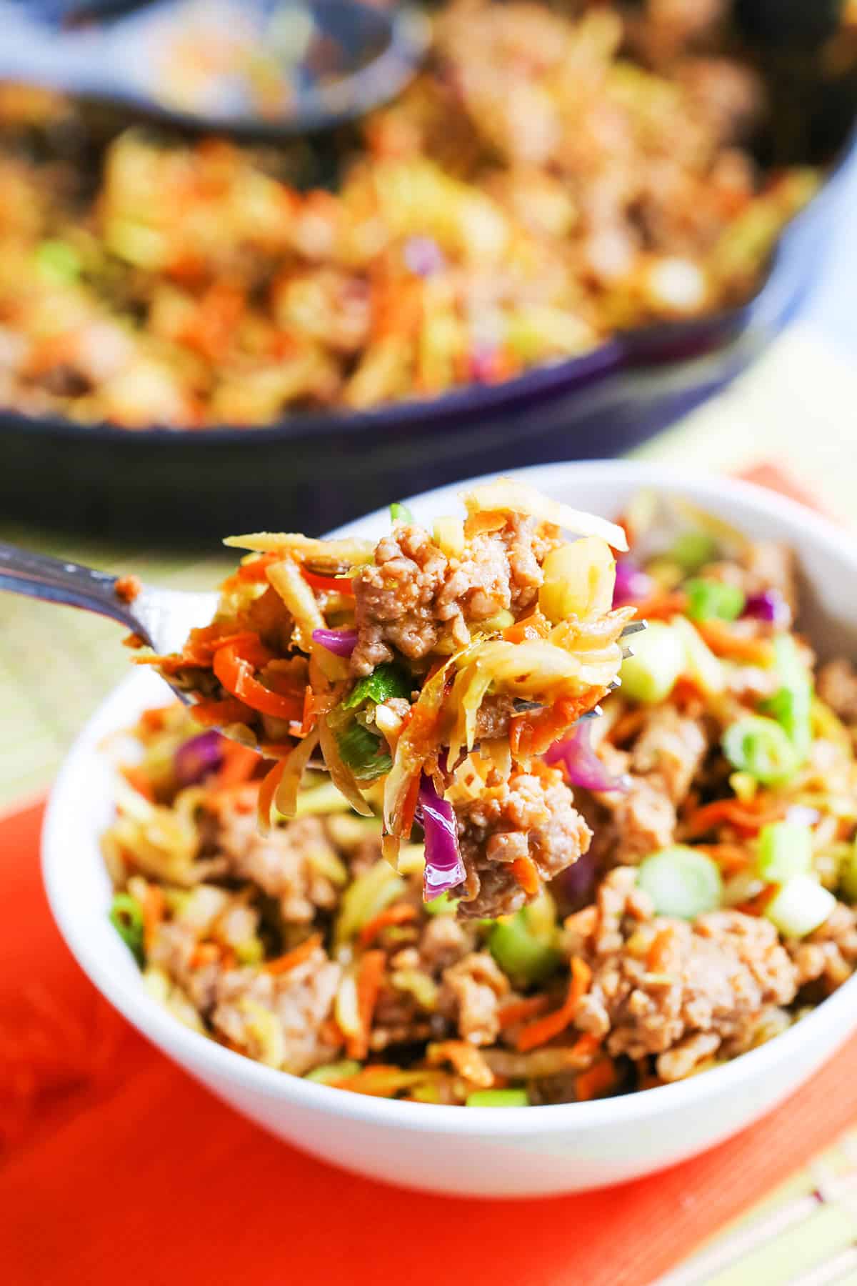 Egg roll bowl with a fork lifting a bite out of it.