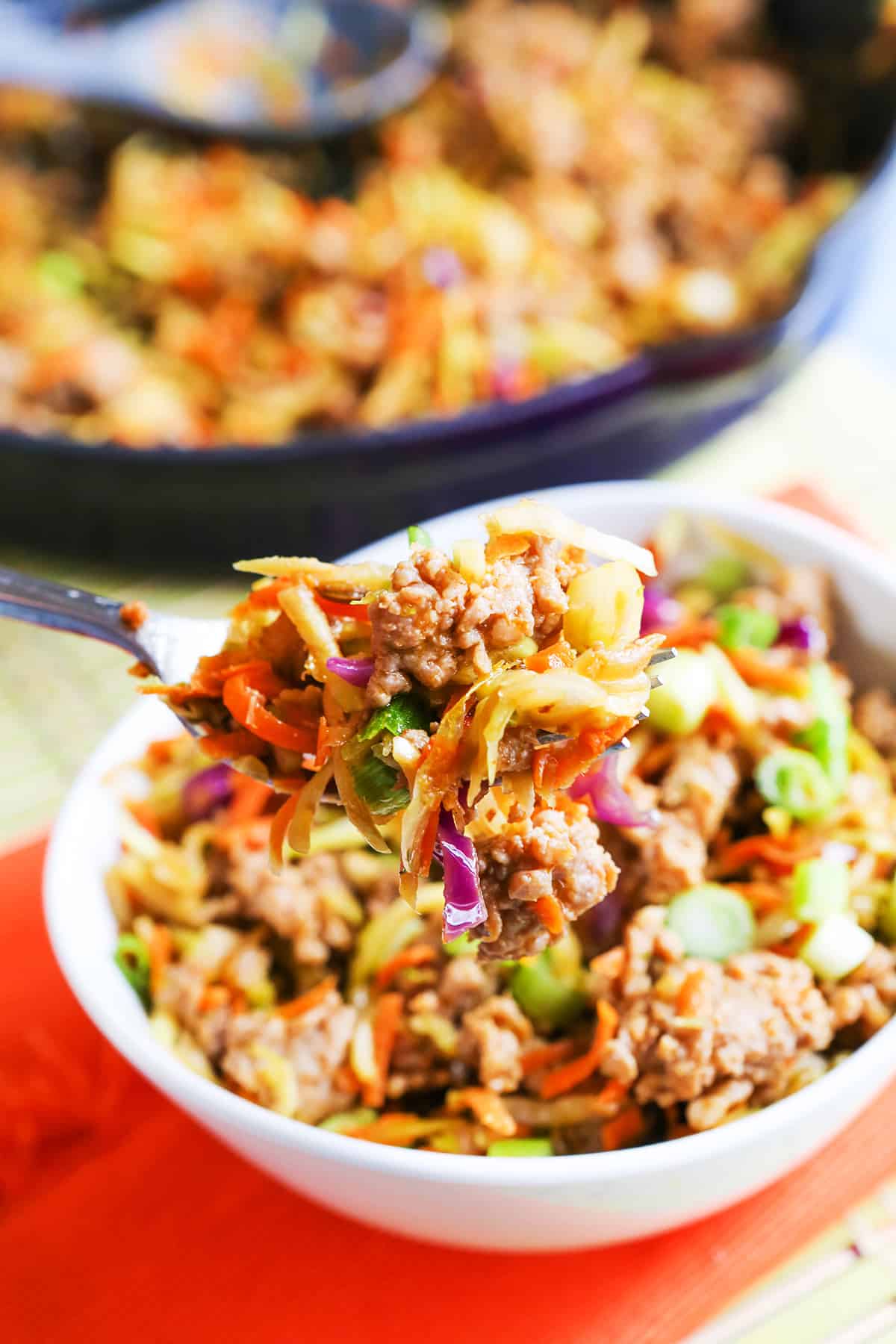 forkful of egg roll bowl being scooped out of bowl.