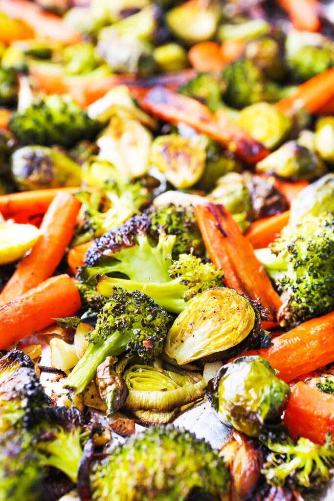 Roasted vegetables on a sheet pan. 