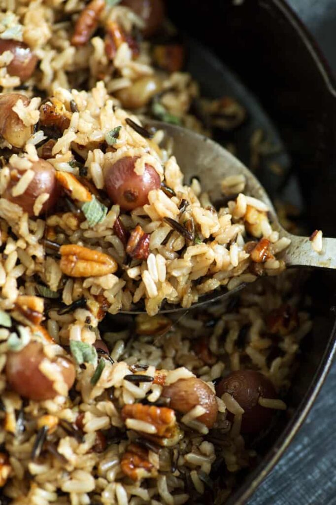 Spoonful of wild rice with roasted grapes. 