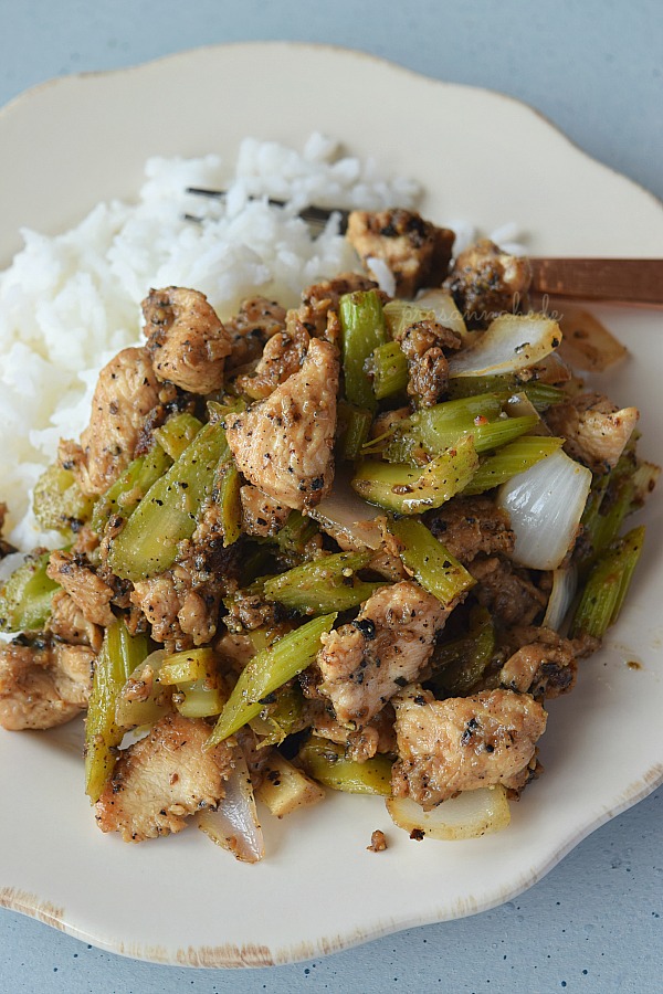 Rice and black pepper chicken on a plate ready to eat. 