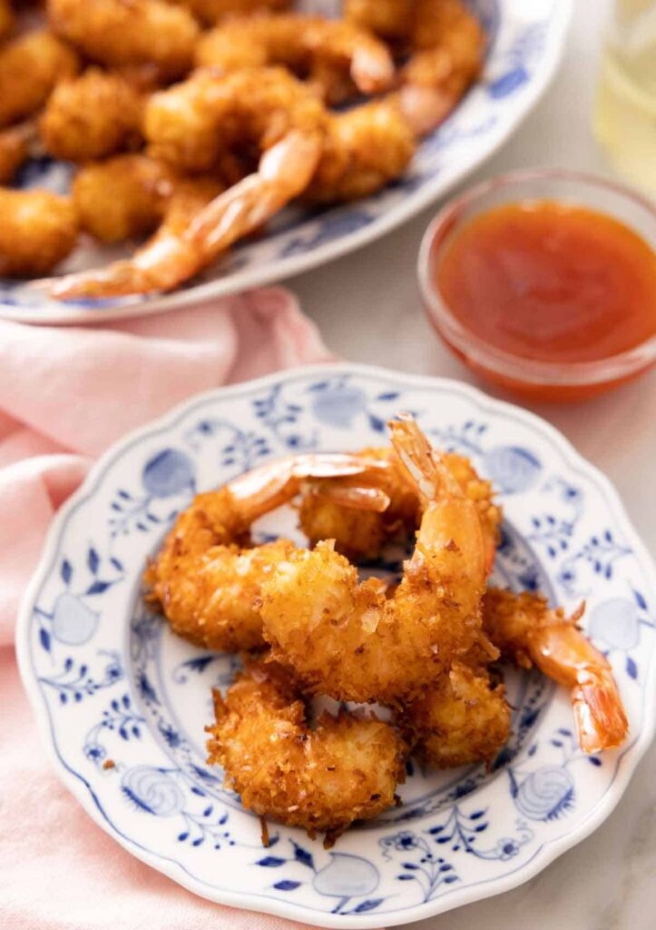 Coconut shrimp on a small plate. 