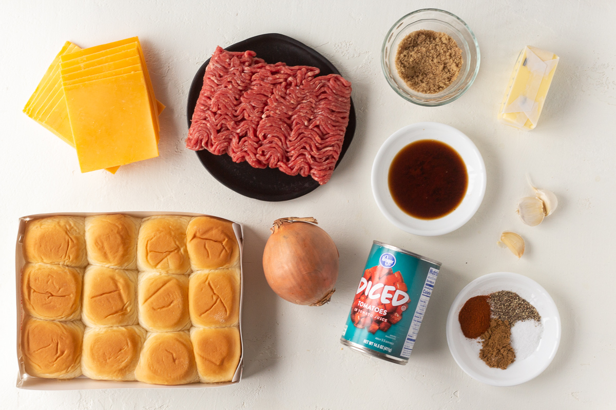 Ground beef slider ingredients lined up on a counter.