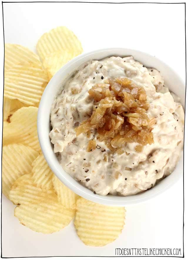 Bowl of caramelized onion dip with wavy potato chips next to the bowl. 