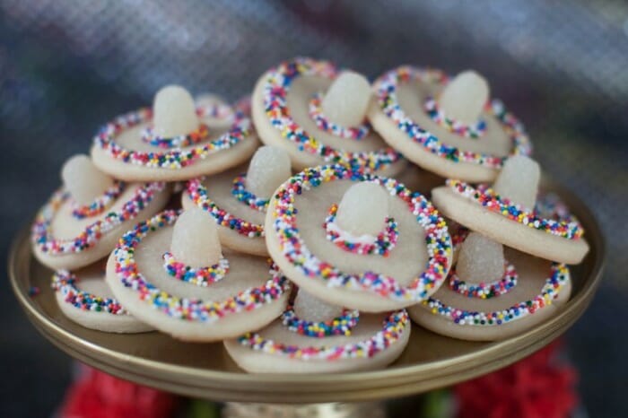 Sombrero cookies piled up on a serving plate. 