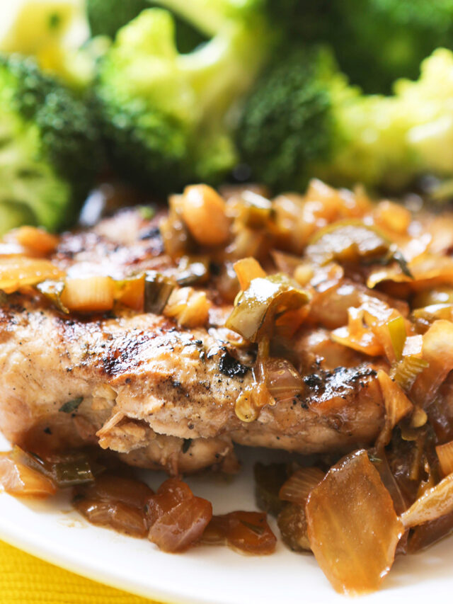 Jerk chicken with broccoli served on a plate. 