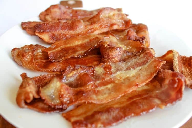 Air fryer bacon on a plate. 