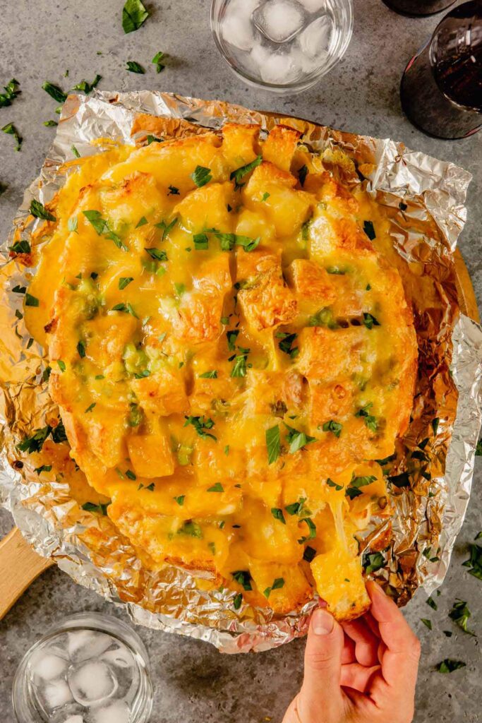 Cheesy Pull Apart bread sitting on aluminum foil. 