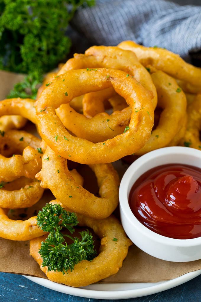 Homemade onion rings with a side of ketchup. 