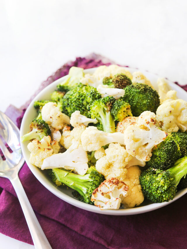 Air fryer cauliflower and broccoli in a bowl. 