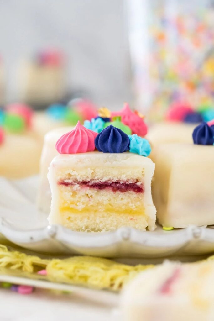 Close up of a few petit four mini cakes. 