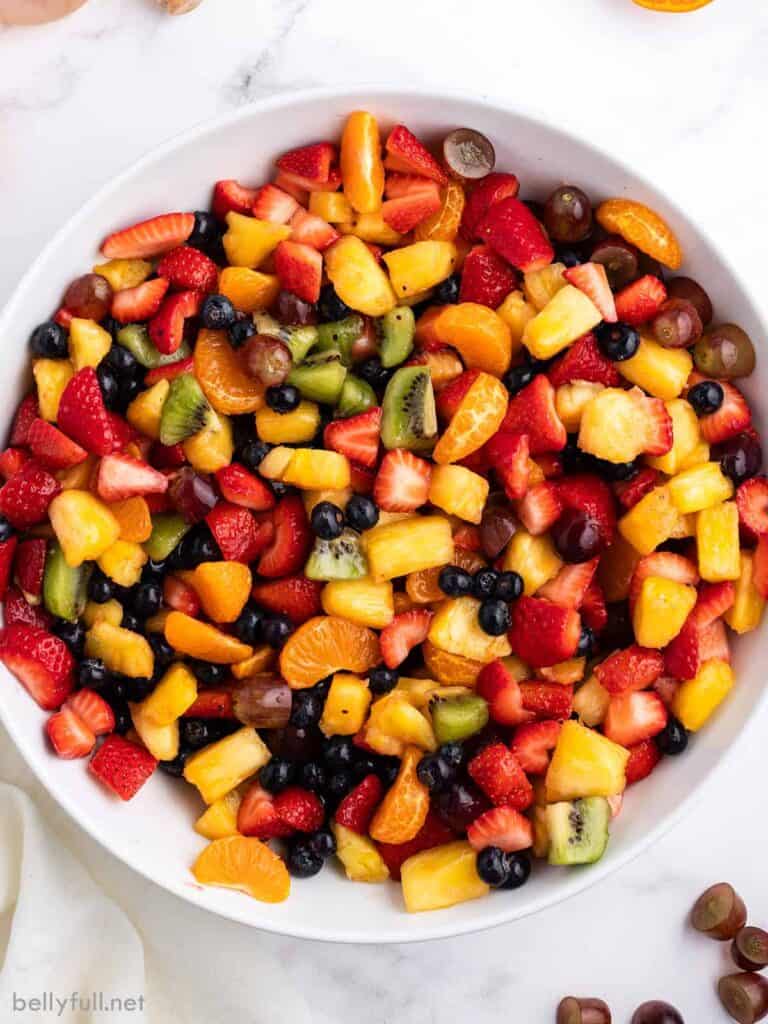 Bowl of chopped fruit in a serving bowl. 
