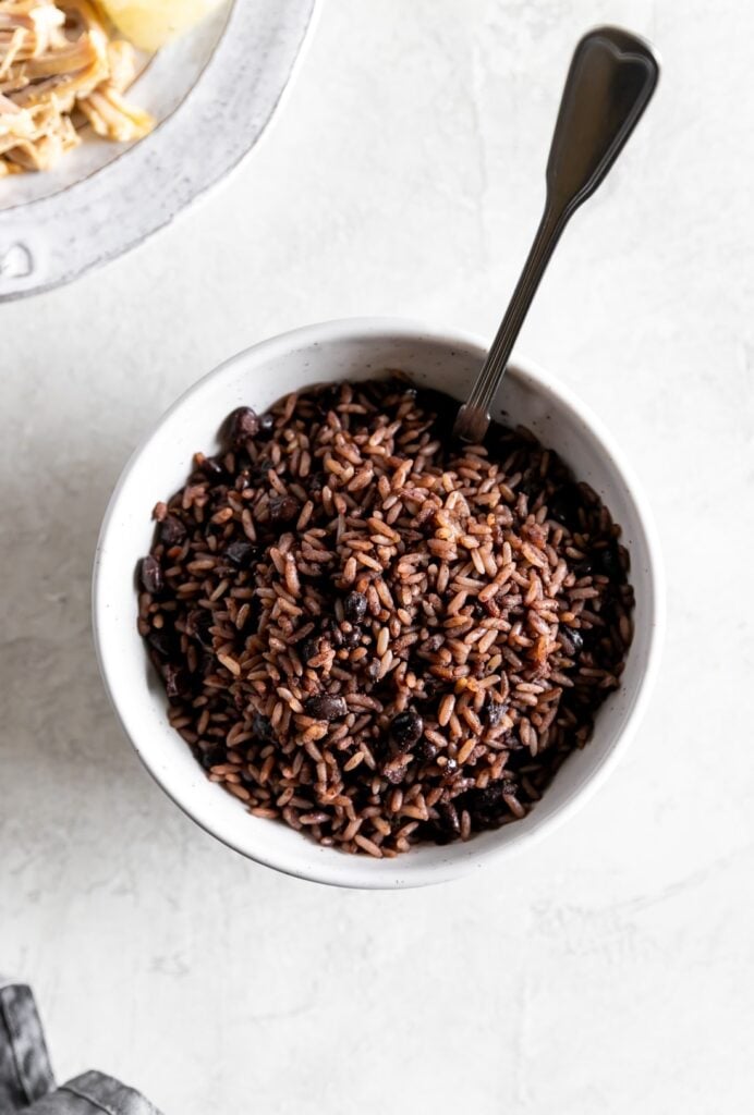 Cuban black beans and rice in a white bowl. 