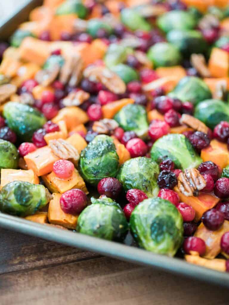 Honey roasted vegetables in a baking sheet. 