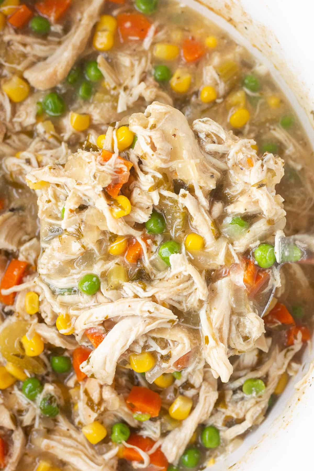 Close up of cooked pot pie mixture in a crockpot.