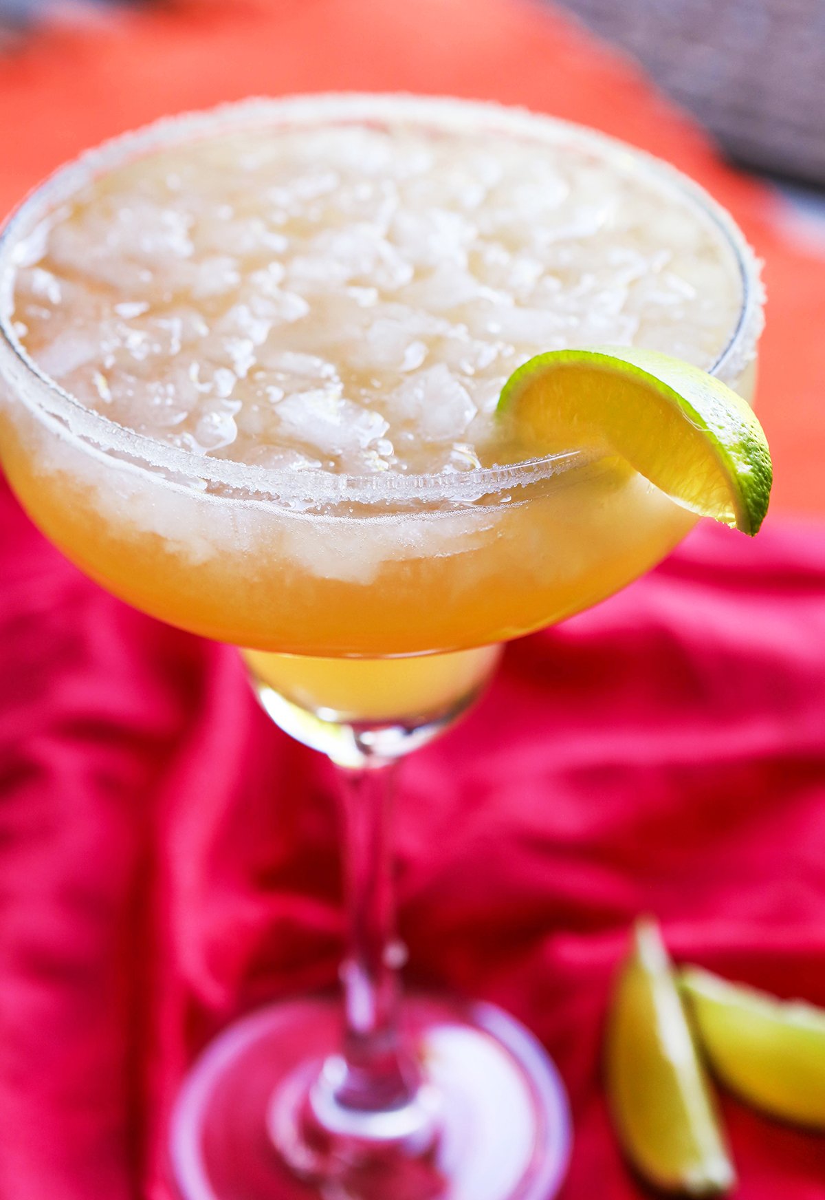 Perfect margarita with lime wedge and salt.